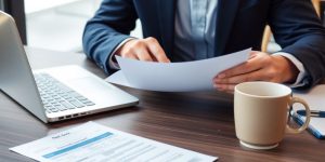 Business professional opening a new bank account paperwork.